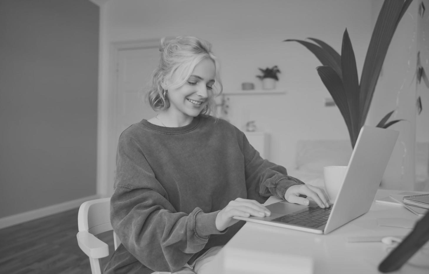 Student workspace with financial documents and laptop showing market analysis